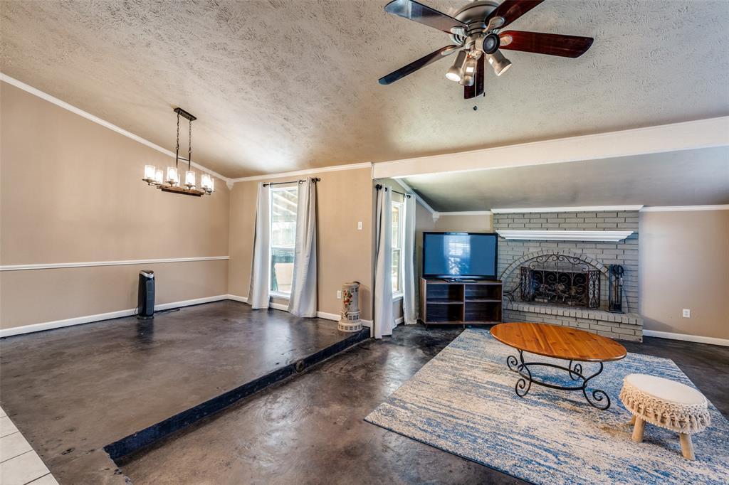 3108 Spring Valley Drive Bedford, TX 76021 - Photo 5 of 26 Open family dining and living room Fireplace