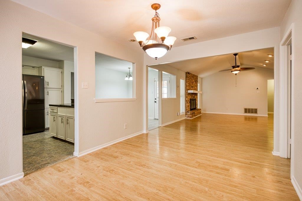 113 Seco Drive Portland, TX 78374 - Photo 11 of 37 wooden floor in an empty room with a mirror