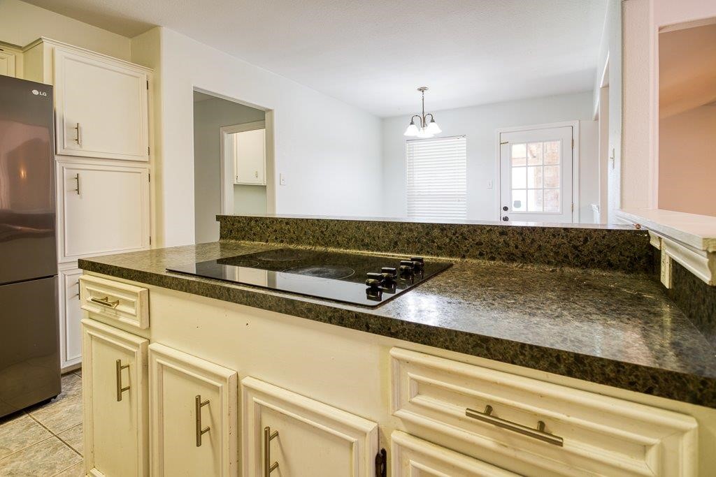 113 Seco Drive Portland, TX 78374 - Photo 15 of 37 a bathroom with a granite countertop sink and a bathtub