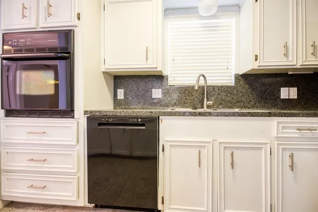 an empty room with windows and entrance