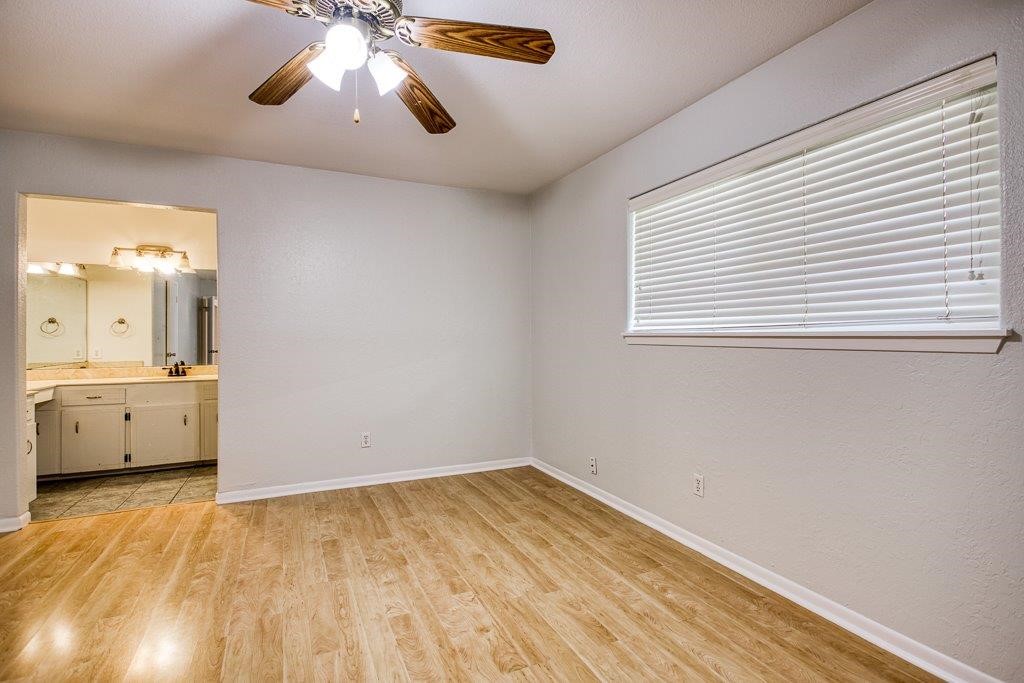 113 Seco Drive Portland, TX 78374 - Photo 23 of 37 wooden floor in an empty room with a window
