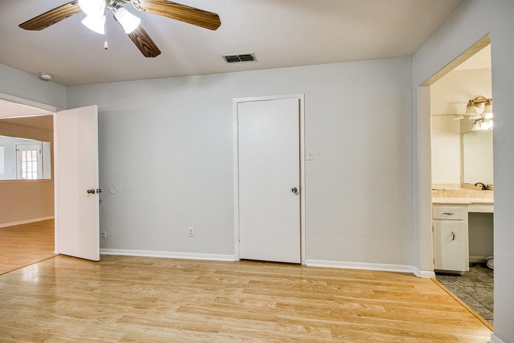 113 Seco Drive Portland, TX 78374 - Photo 24 of 37 a view of an empty room with window and wooden floor