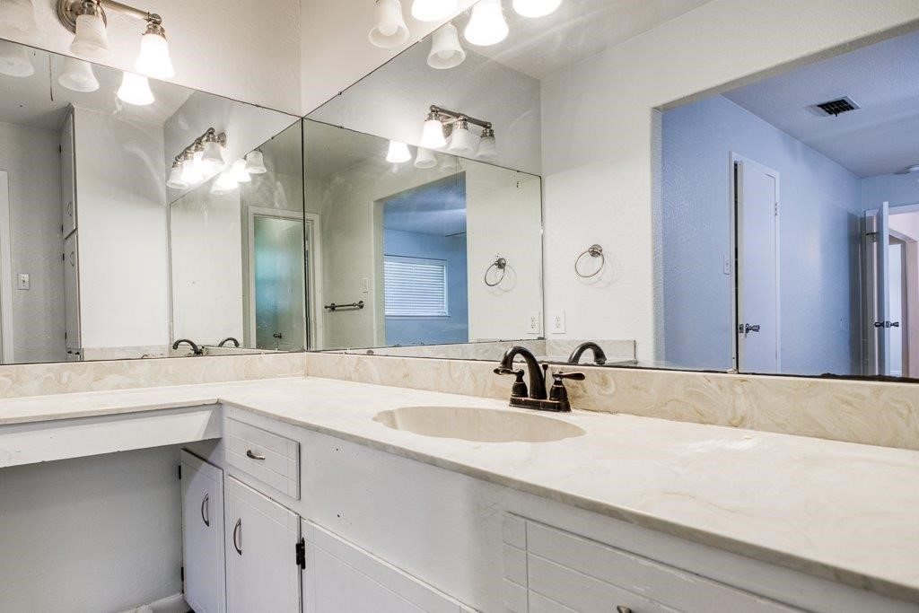 113 Seco Drive Portland, TX 78374 - Photo 25 of 37 a bathroom with a sink and a mirror