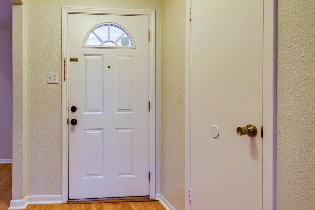 113 Seco Drive Portland, TX 78374 - Photo 3 of 37 a view of a hallway with wooden floor