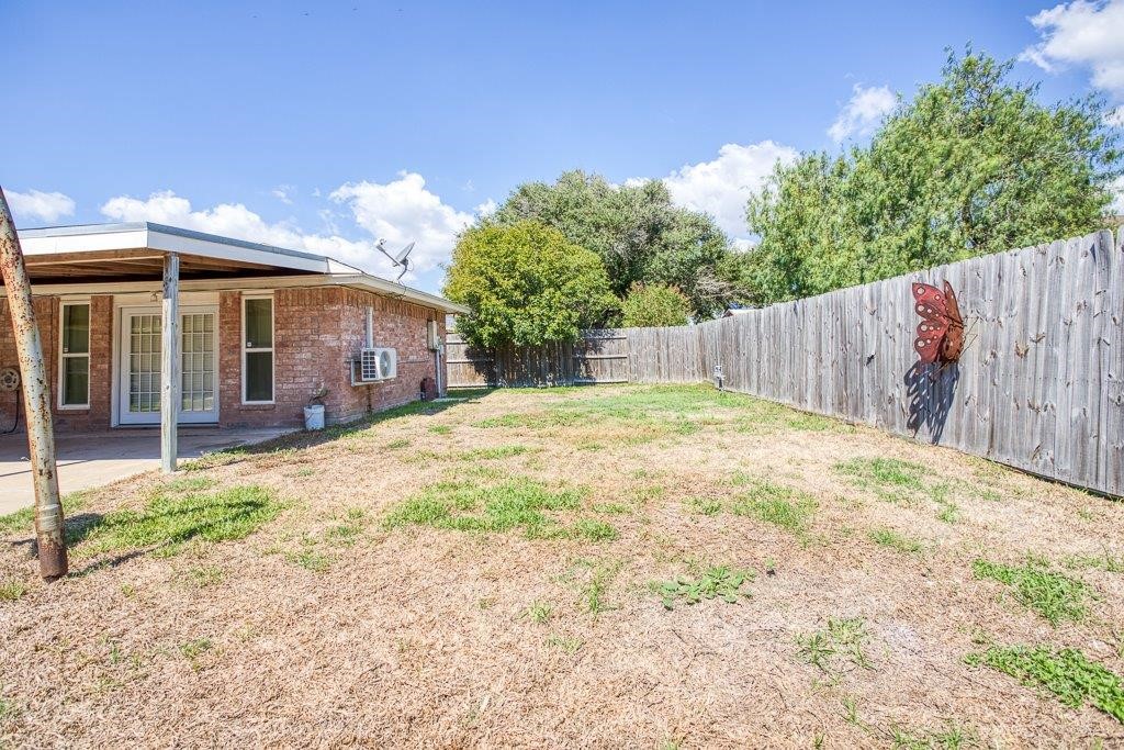 113 Seco Drive Portland, TX 78374 - Photo 37 of 37 a front view of a house with a yard and potted plants