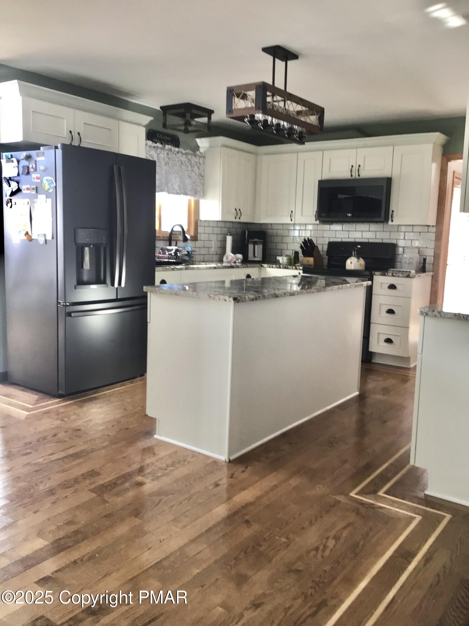 534 Sandt Road Pen Argyl, PA 18072 - Photo 19 of 77 a kitchen with stainless steel appliances granite countertop a refrigerator a stove and a sink
