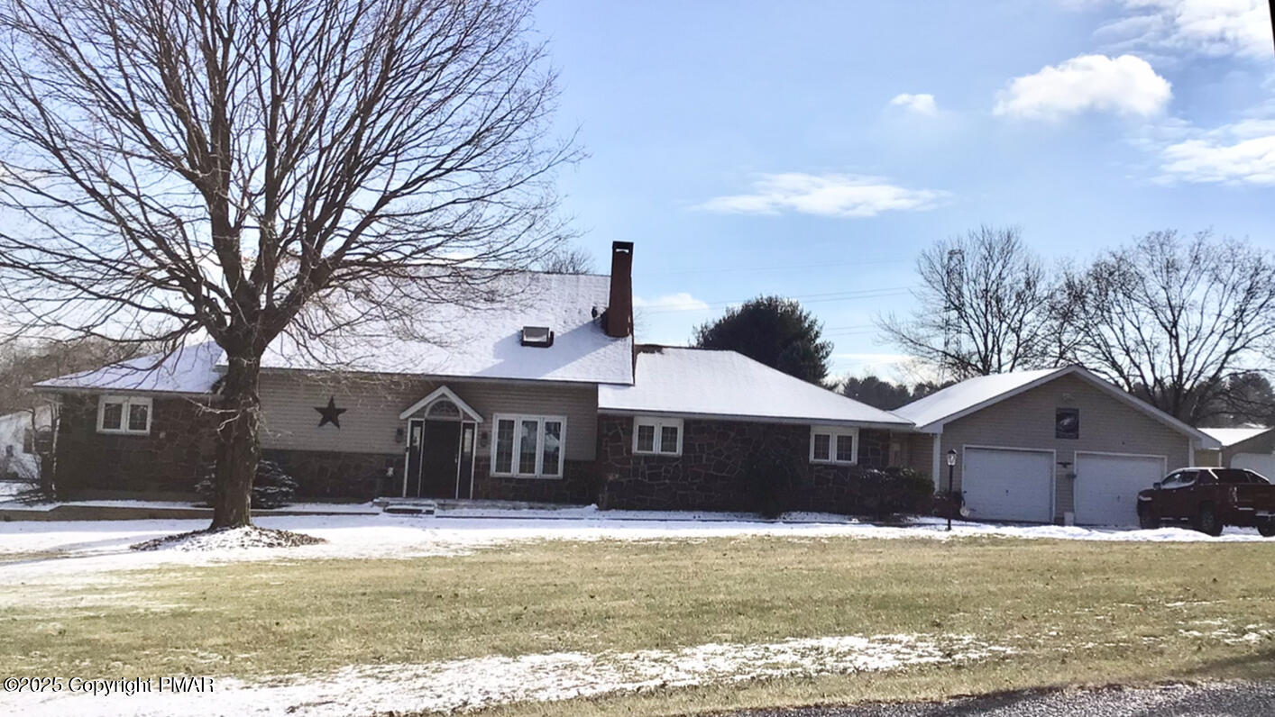 534 Sandt Road Pen Argyl, PA 18072 - Photo 2 of 77 a front view of a house with a yard and garage