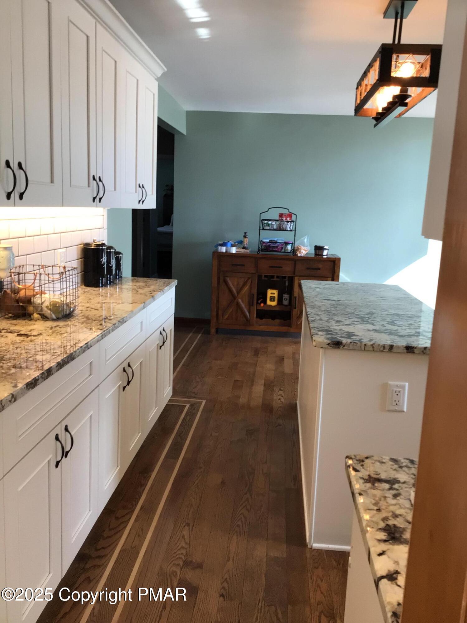 534 Sandt Road Pen Argyl, PA 18072 - Photo 22 of 77 a kitchen with granite countertop cabinets stainless steel appliances and a counter space