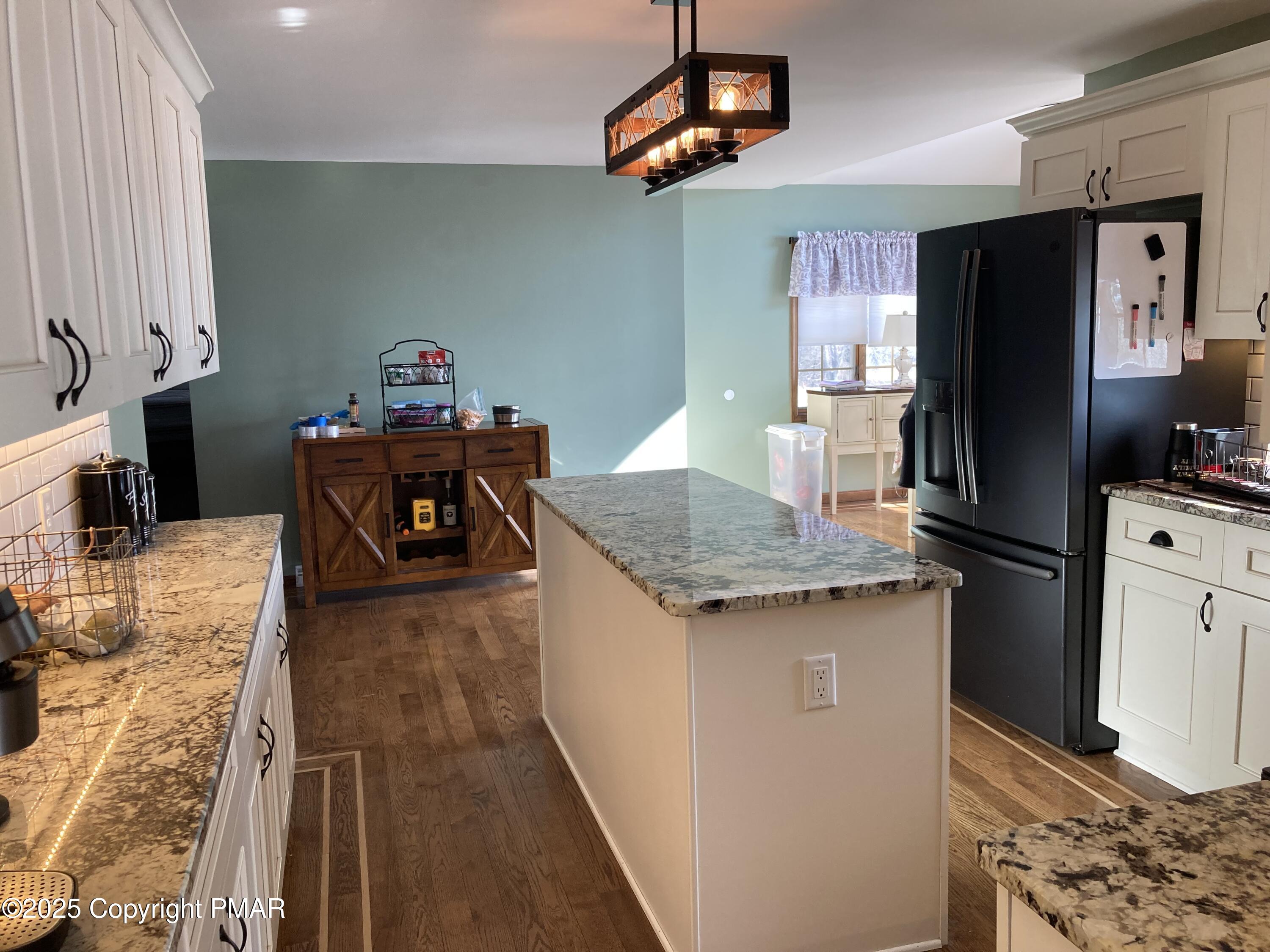 534 Sandt Road Pen Argyl, PA 18072 - Photo 23 of 77 a kitchen with stainless steel appliances granite countertop a sink dishwasher a refrigerator a microwave oven with granite countertops and cabinets
