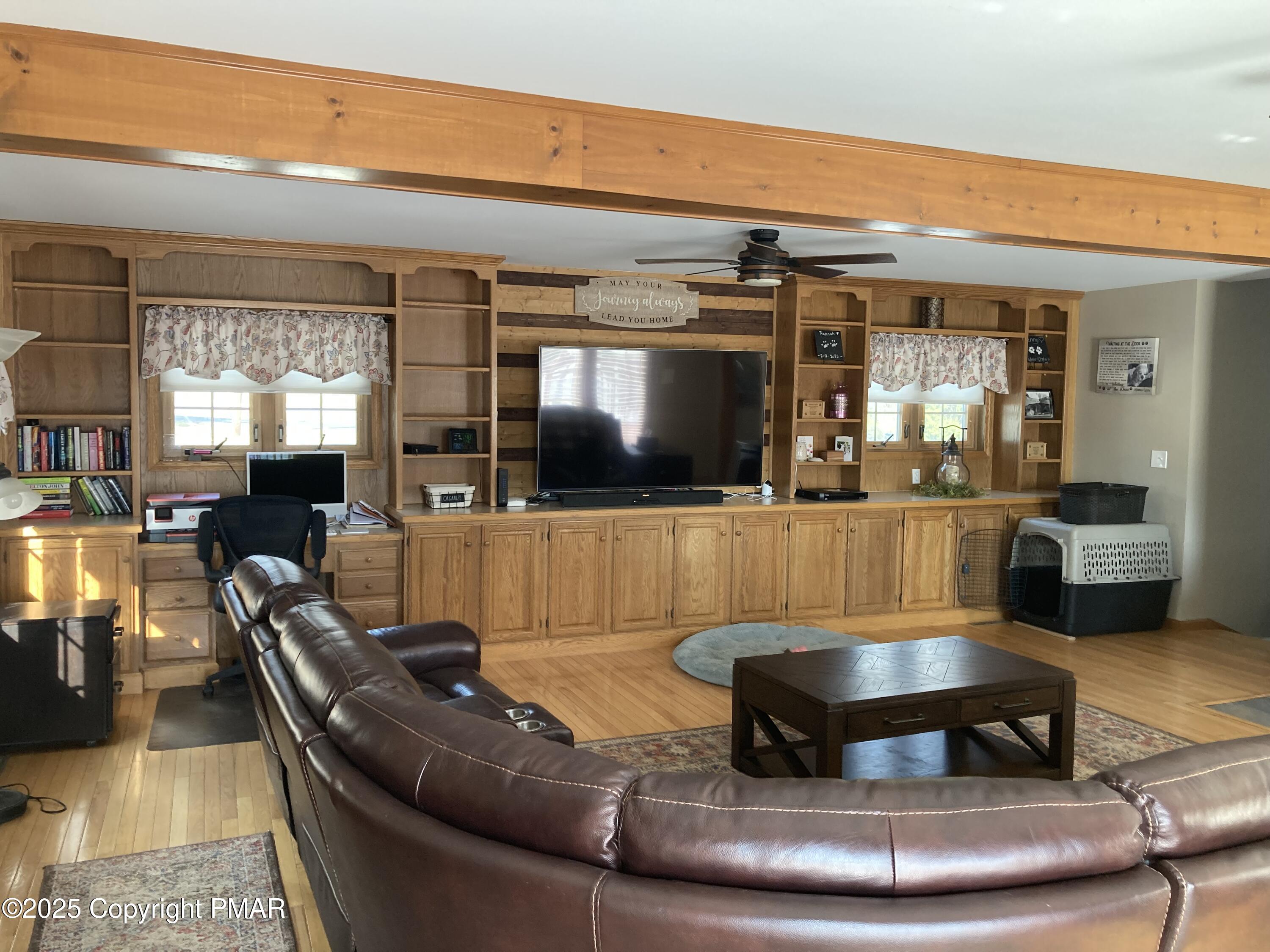 534 Sandt Road Pen Argyl, PA 18072 - Photo 30 of 77 a living room with furniture and a flat screen tv