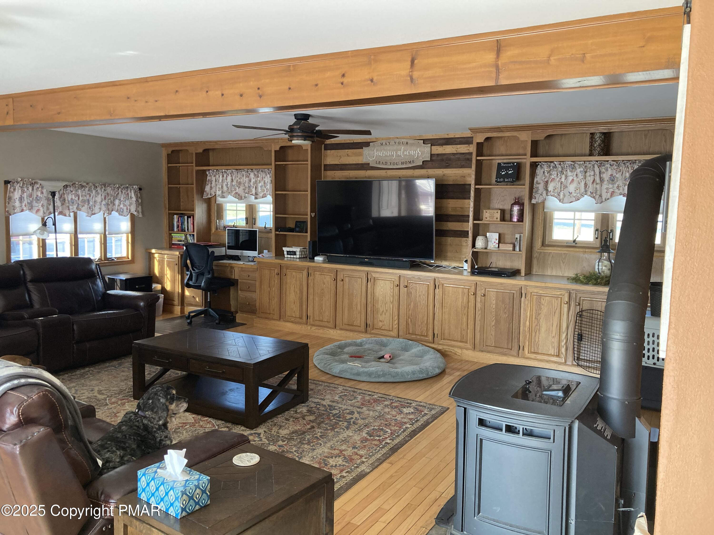 534 Sandt Road Pen Argyl, PA 18072 - Photo 31 of 77 a living room with furniture and a flat screen tv