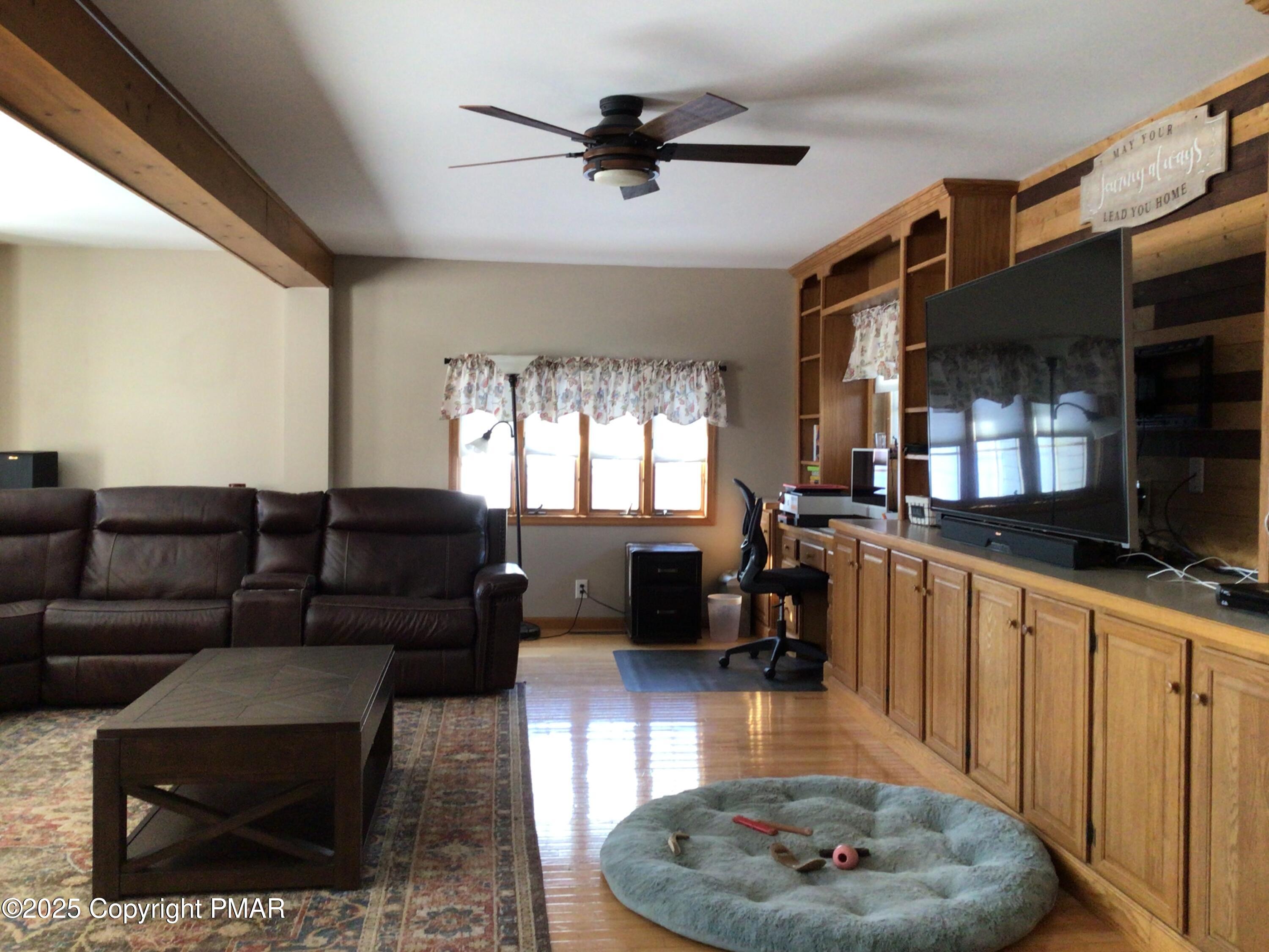 534 Sandt Road Pen Argyl, PA 18072 - Photo 32 of 77 a living room with furniture and a wooden floor