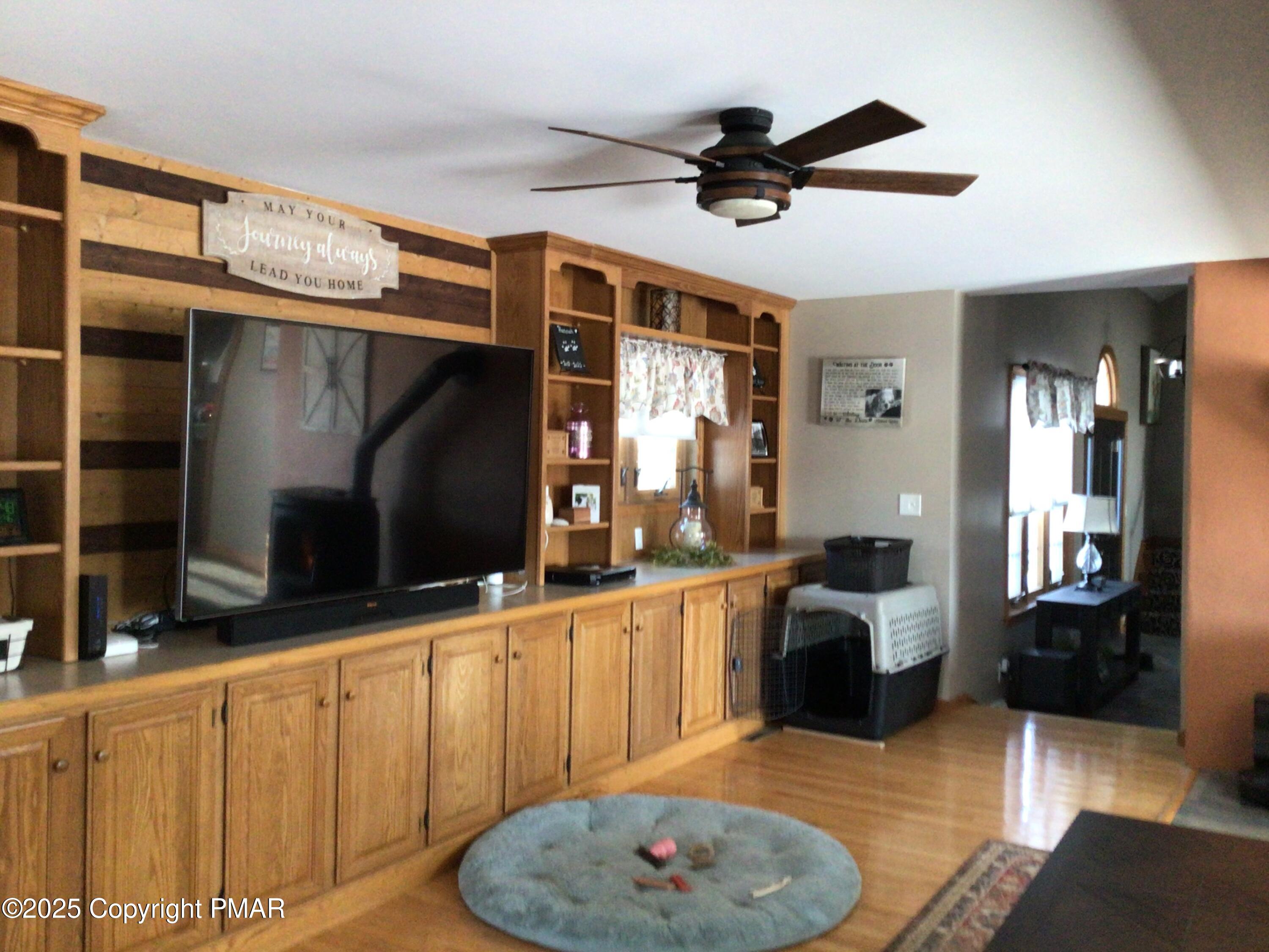 534 Sandt Road Pen Argyl, PA 18072 - Photo 33 of 77 a living room with furniture a flat screen tv and a rug