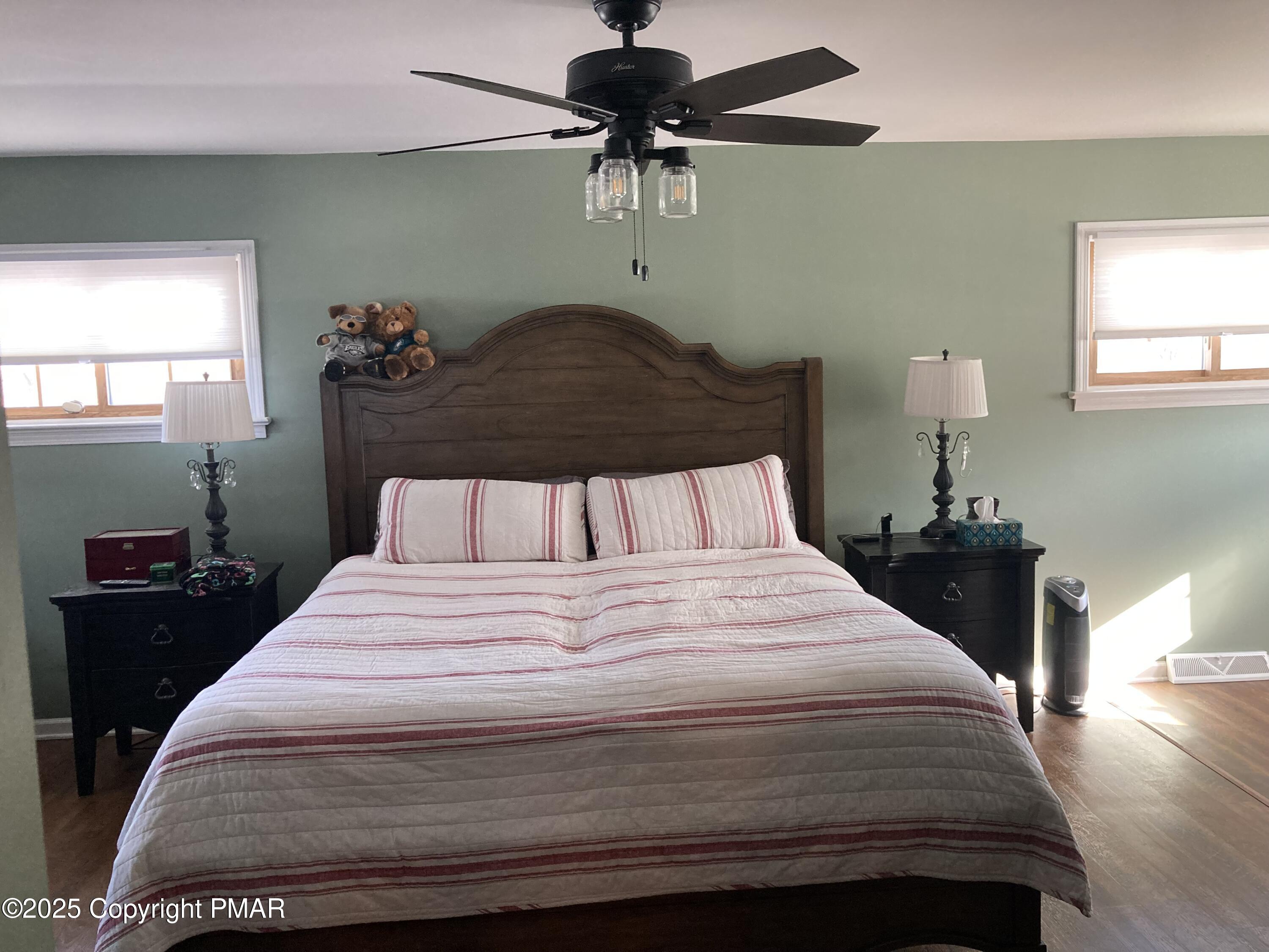 534 Sandt Road Pen Argyl, PA 18072 - Photo 40 of 77 a bedroom with a bed and a chandelier