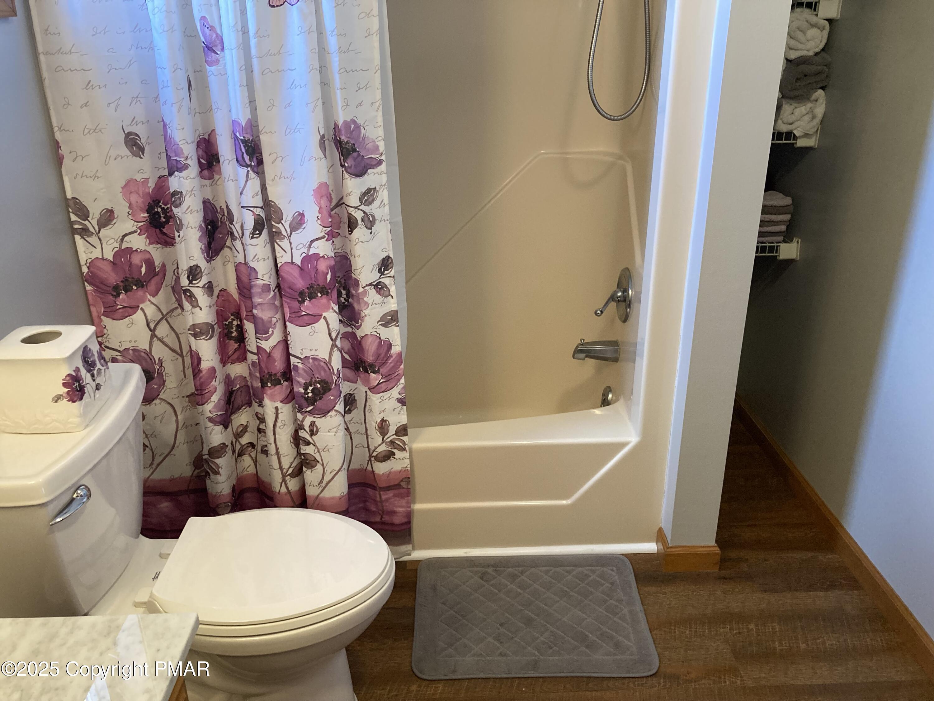 534 Sandt Road Pen Argyl, PA 18072 - Photo 52 of 77 a bathroom with a toilet and a shower curtain
