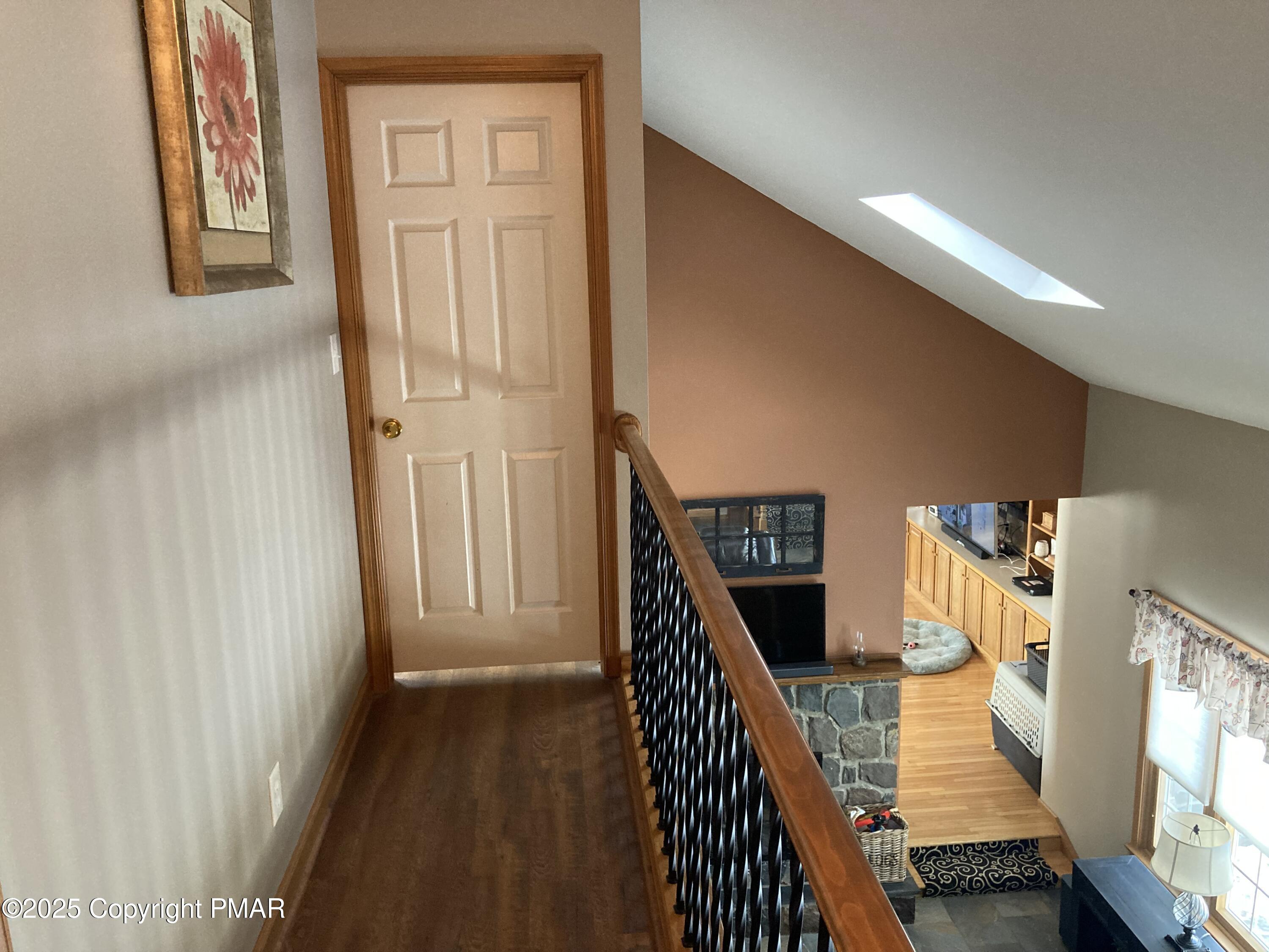 534 Sandt Road Pen Argyl, PA 18072 - Photo 54 of 77 a view of a hallway with wooden floor and stairs
