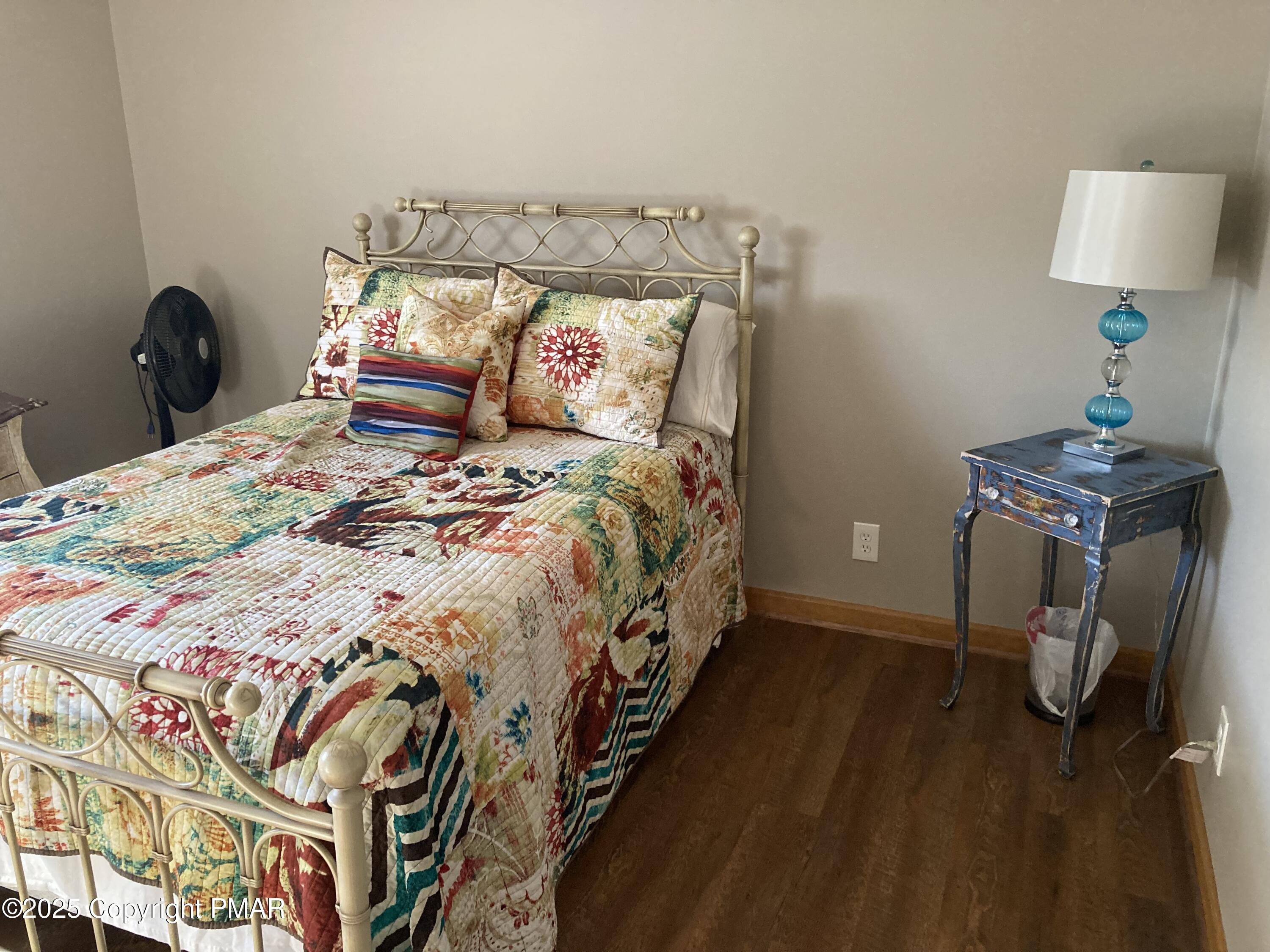 534 Sandt Road Pen Argyl, PA 18072 - Photo 57 of 77 a bed sitting in a bedroom next to a lamp