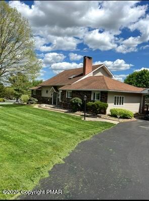 534 Sandt Road Pen Argyl, PA 18072 - Photo 6 of 77 a front view of a house with garden