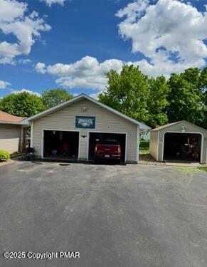 534 Sandt Road Pen Argyl, PA 18072 - Photo 7 of 77 a front view of a house with a yard and garage