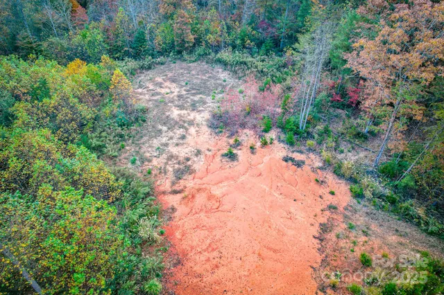 a backyard of a house with a yard and outdoor seating