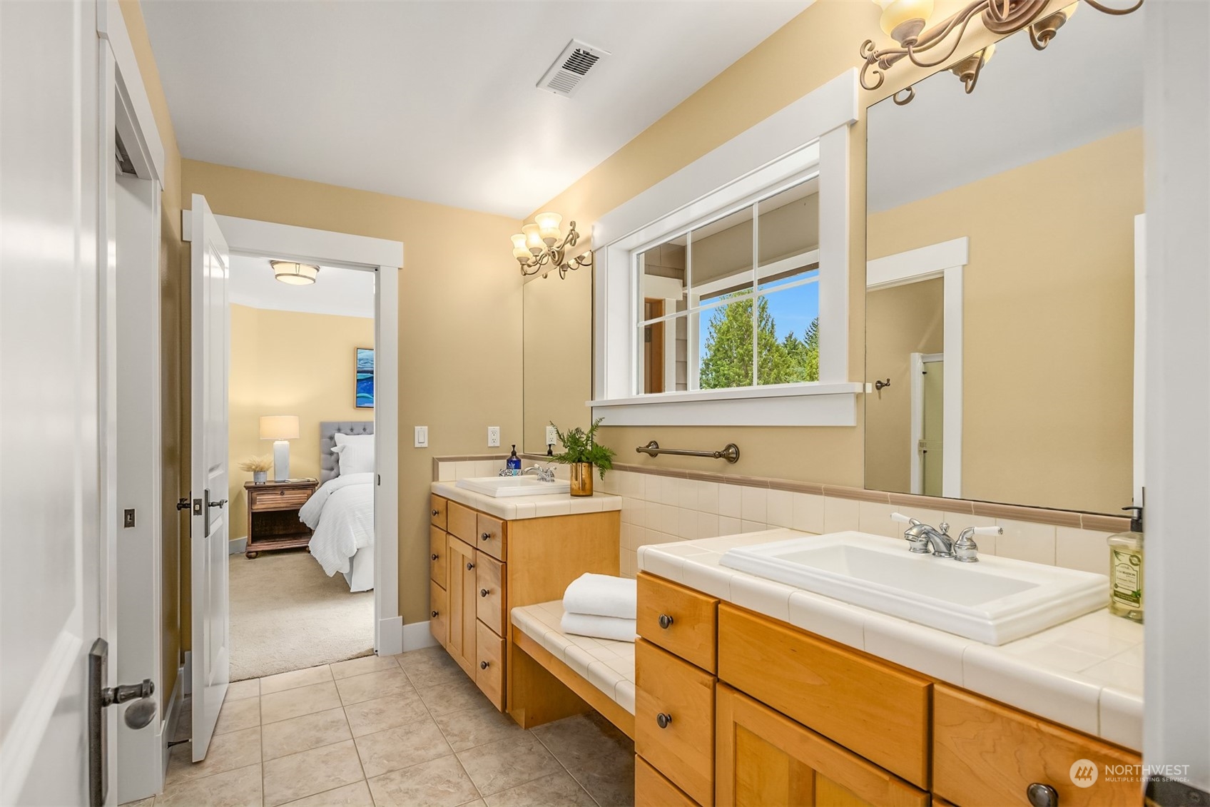6428 Haley Loop Road Northeast Bainbridge Island, WA 98110 - Photo 21 of 40 a bathroom with a sink double vanity and a shower