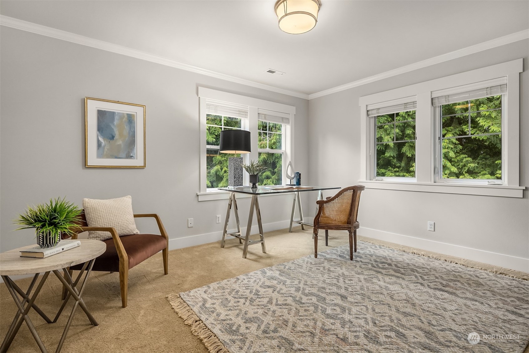 6428 Haley Loop Road Northeast Bainbridge Island, WA 98110 - Photo 23 of 40 a living room with furniture and a large window