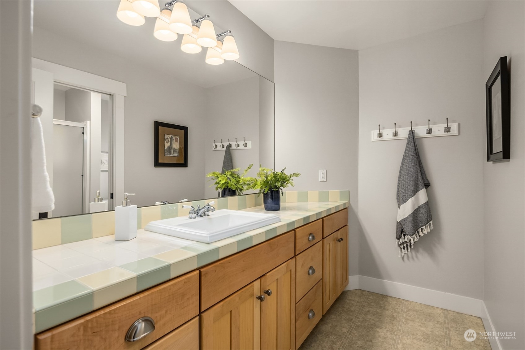 6428 Haley Loop Road Northeast Bainbridge Island, WA 98110 - Photo 24 of 40 a bathroom with a sink vanity granite and a mirror