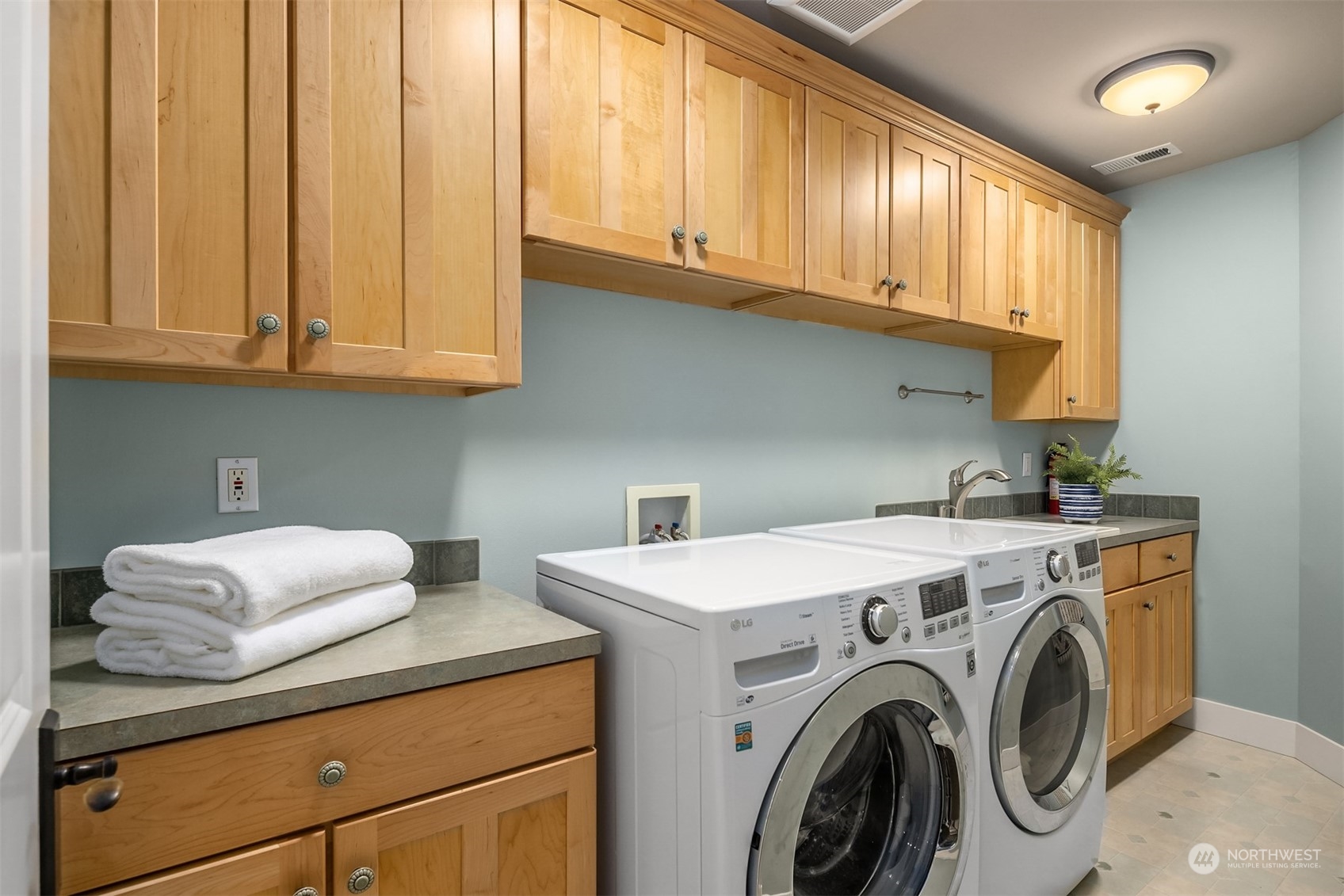 6428 Haley Loop Road Northeast Bainbridge Island, WA 98110 - Photo 27 of 40 a utility room with dryer and washer