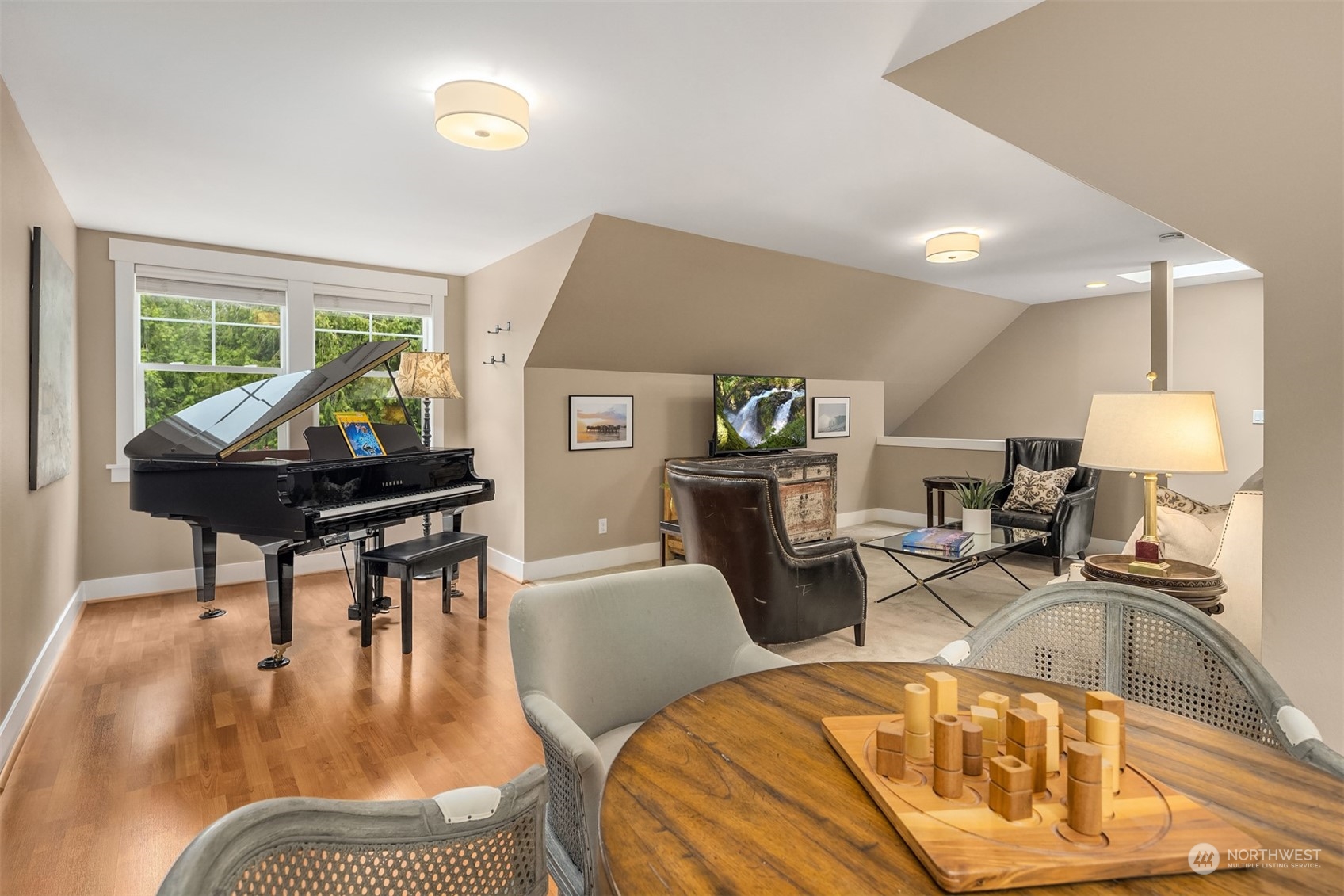 6428 Haley Loop Road Northeast Bainbridge Island, WA 98110 - Photo 31 of 40 a living room with furniture a piano and a table