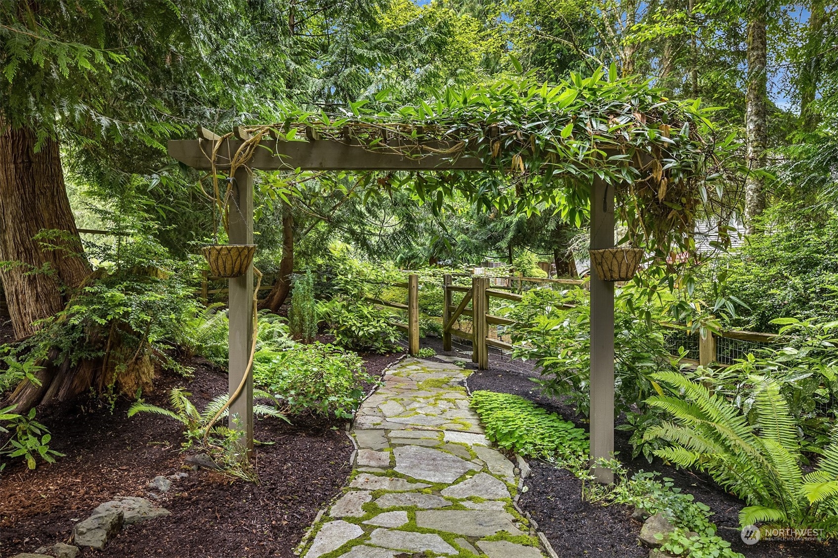 6428 Haley Loop Road Northeast Bainbridge Island, WA 98110 - Photo 36 of 40 a view of a pathway both side of yard