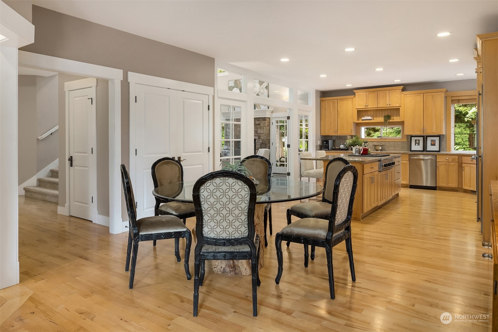 6428 Haley Loop Road Northeast Bainbridge Island, WA 98110 - Photo 8 of 40 a view of a dining room with furniture window and wooden floor