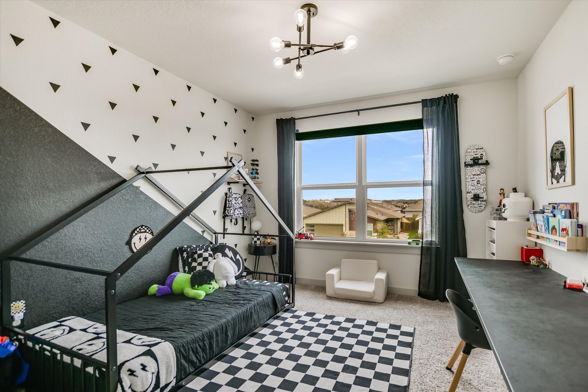 117 Deserti Road Leander, TX 78641 - Photo 15 of 21 Bedroom with light carpet and hanging lights