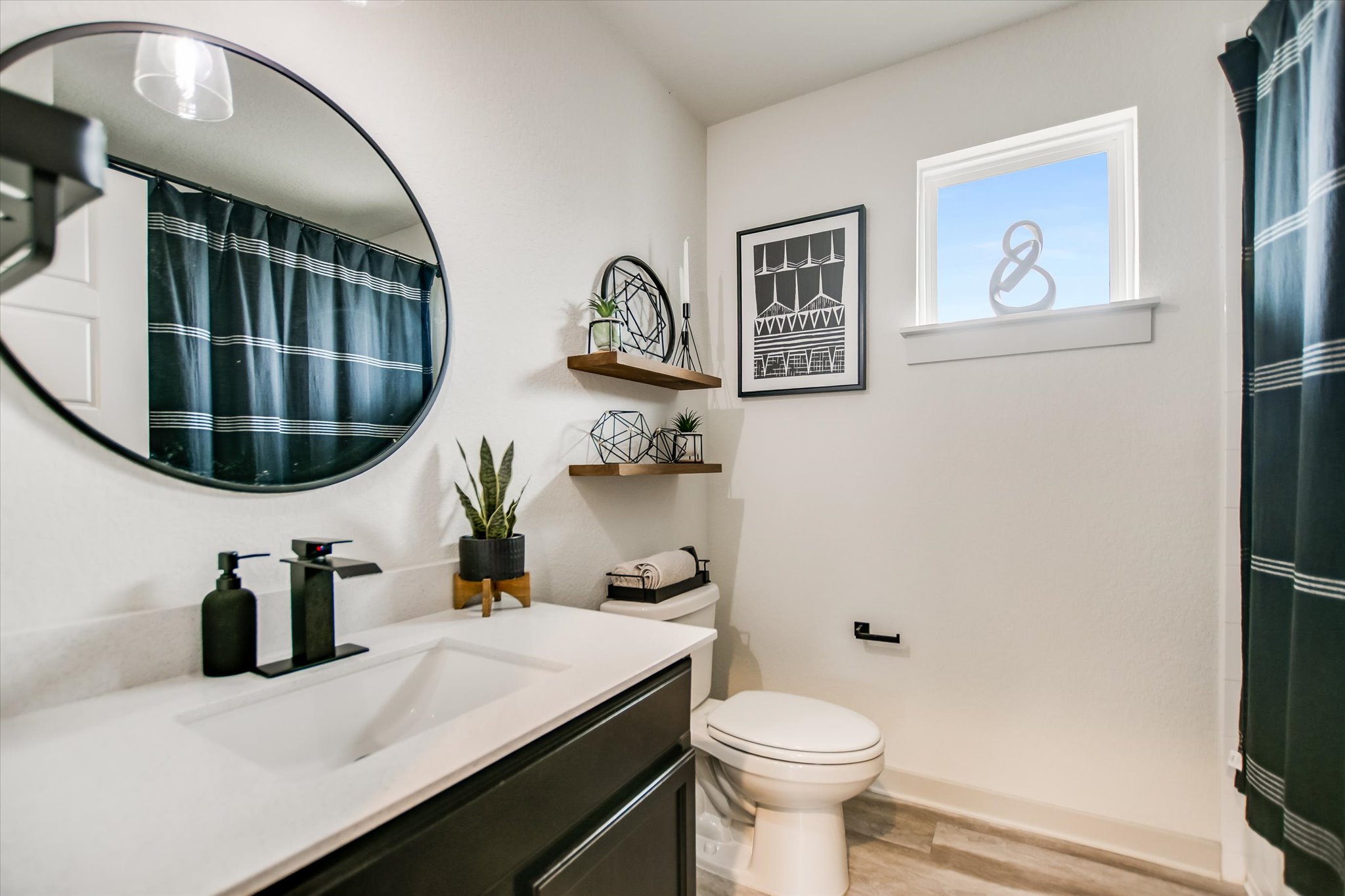 117 Deserti Road Leander, TX 78641 - Photo 16 of 21 Bathroom featuring vanity, a shower with shower curtain, and light wood finished floors