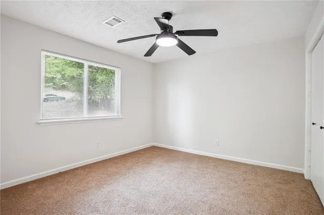 a view of backyard with a deck and wooden floor