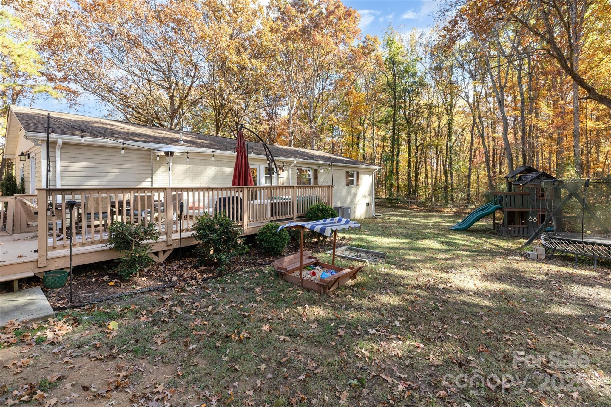 3209 Fincher Road Matthews, NC 28104 - Photo 20 of 24 a backyard of a house with barbeque oven table and chairs