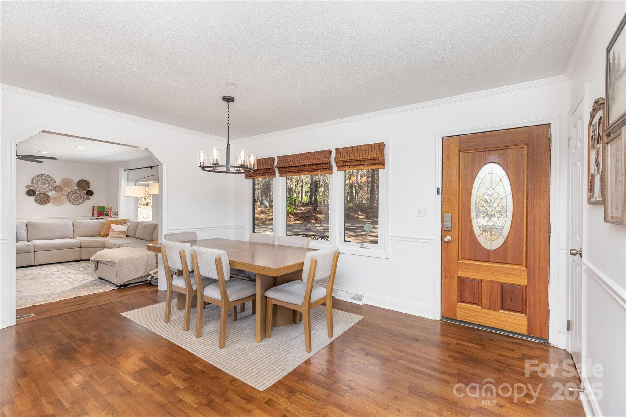 3209 Fincher Road Matthews, NC 28104 - Photo 3 of 24 a living room with furniture a window and wooden floor