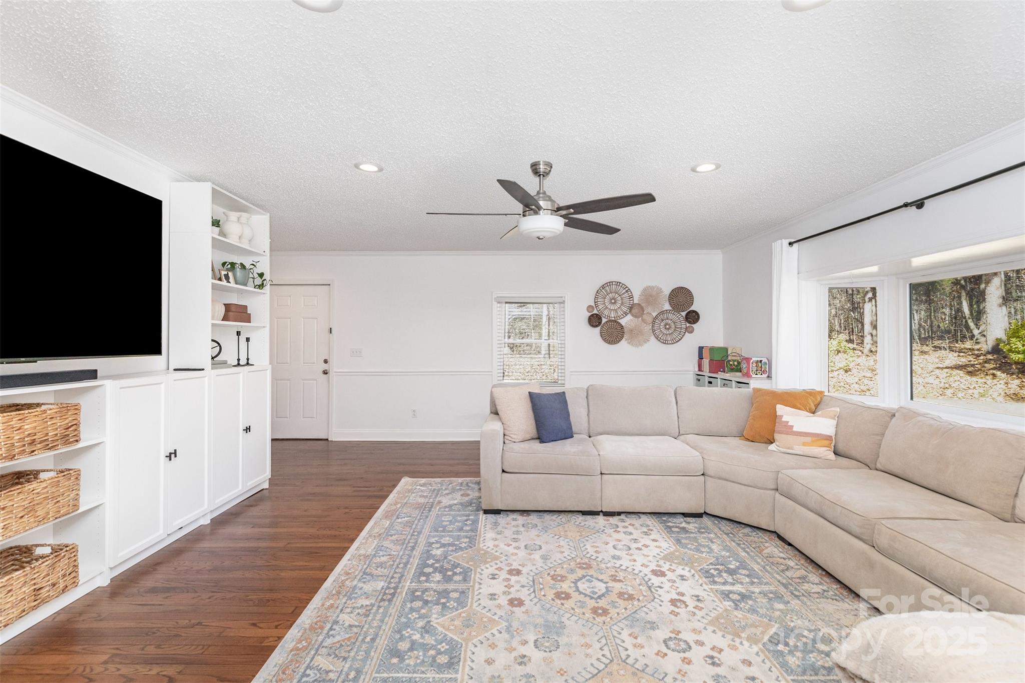 3209 Fincher Road Matthews, NC 28104 - Photo 10 of 24 a living room with furniture and a flat screen tv