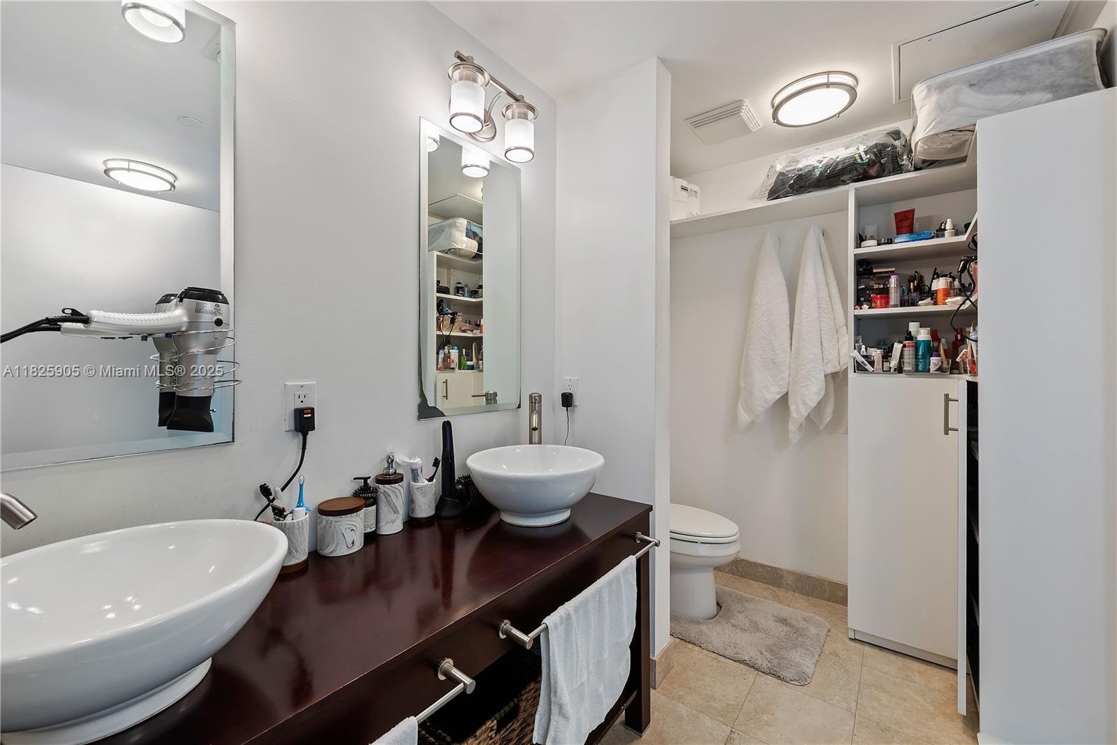 350 South Miami Avenue, Unit 1102 Miami, FL 33130 - Photo 14 of 29 a bathroom with a sink a toilet and shower