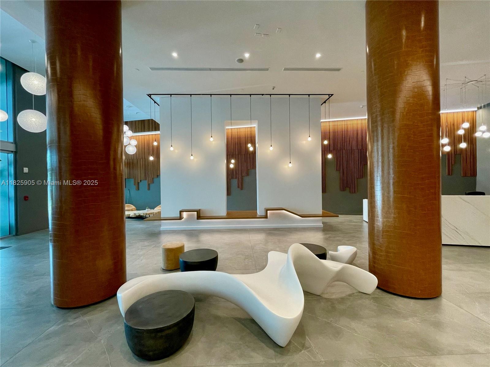 350 South Miami Avenue, Unit 1102 Miami, FL 33130 - Photo 25 of 29 a lobby with furniture and a large mirror