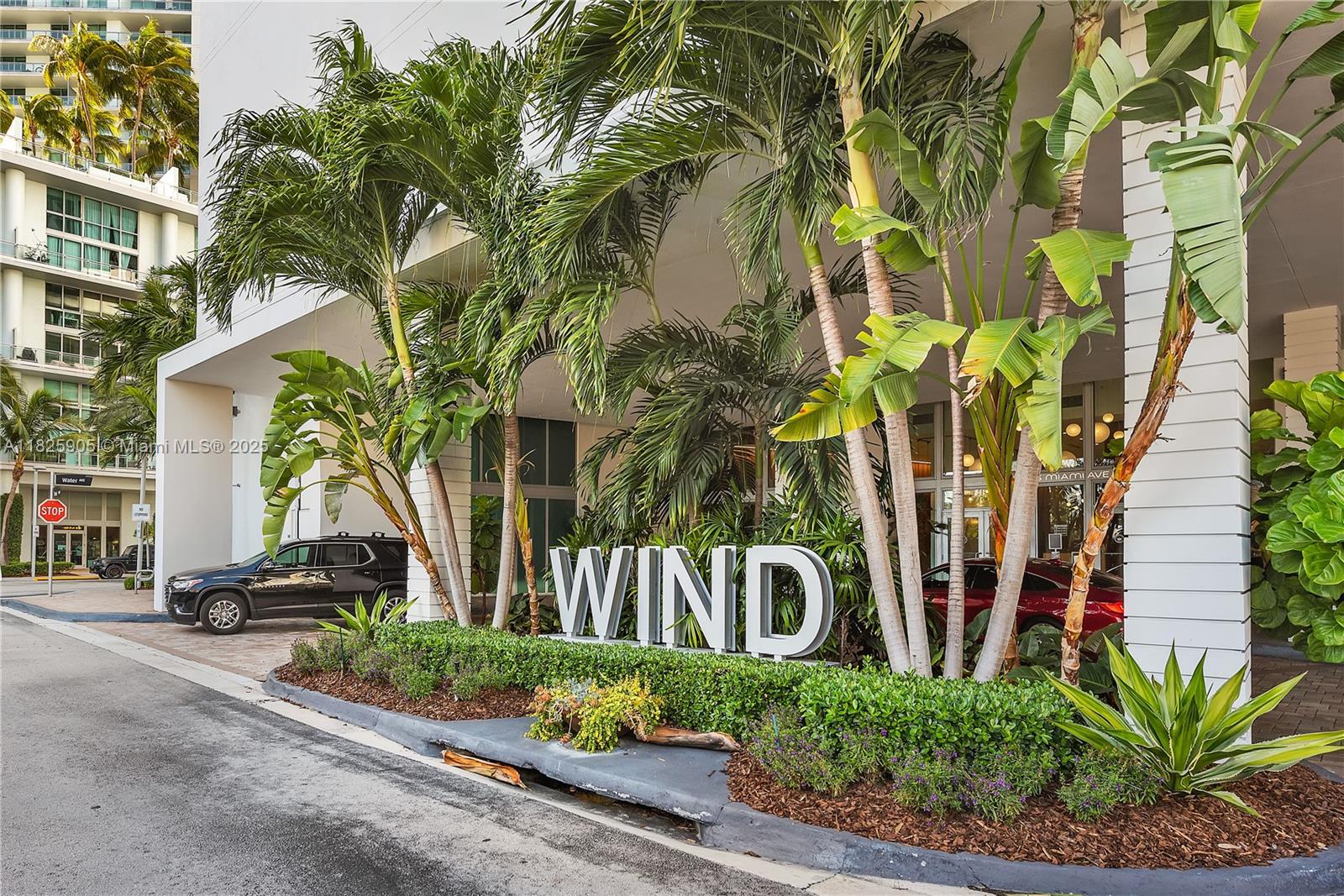 350 South Miami Avenue, Unit 1102 Miami, FL 33130 - Photo 29 of 29 a front view of a house with a yard and potted plants