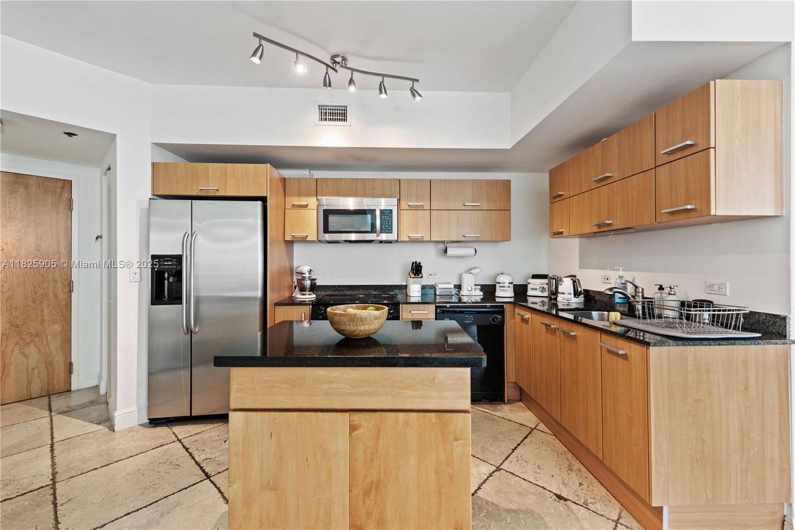 350 South Miami Avenue, Unit 1102 Miami, FL 33130 - Photo 8 of 29 a kitchen with stainless steel appliances granite countertop a refrigerator a sink a stove and a refrigerator
