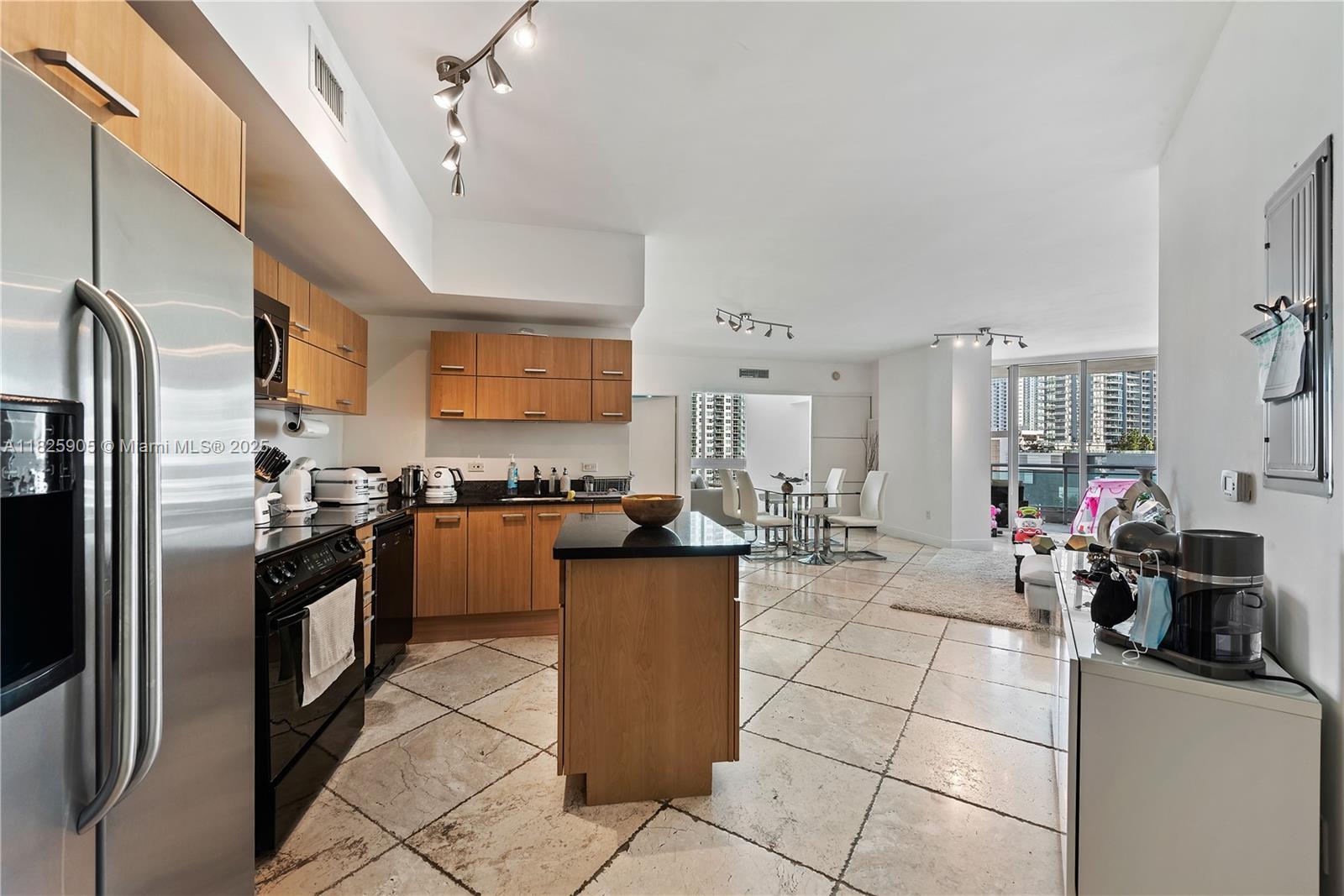 350 South Miami Avenue, Unit 1102 Miami, FL 33130 - Photo 9 of 29 a kitchen with a refrigerator and a sink