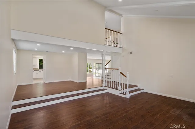 a view of an entryway with wooden floor
