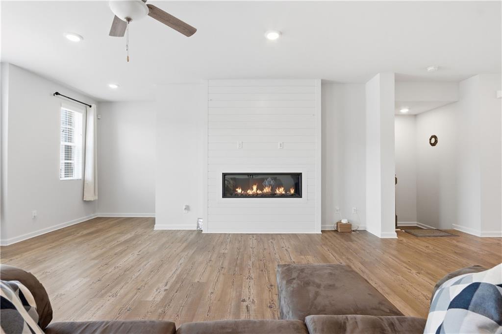 3535 Senna Road Duluth, GA 30096 - Photo 34 of 60 a spacious bedroom with a bed and a couch