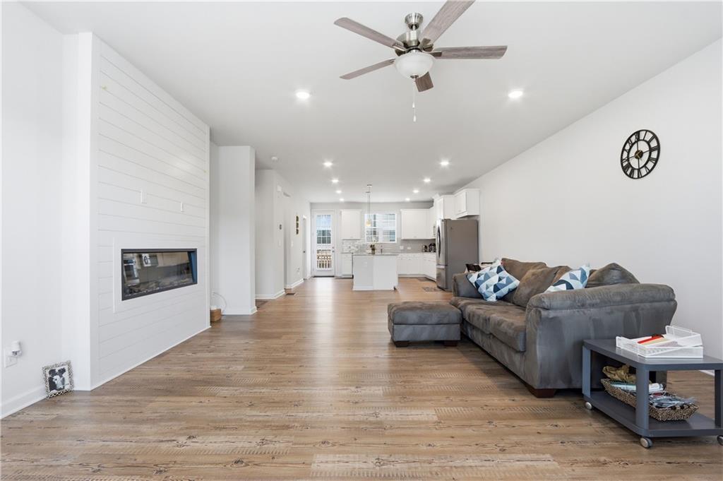 3535 Senna Road Duluth, GA 30096 - Photo 37 of 60 a living room with furniture and kitchen view