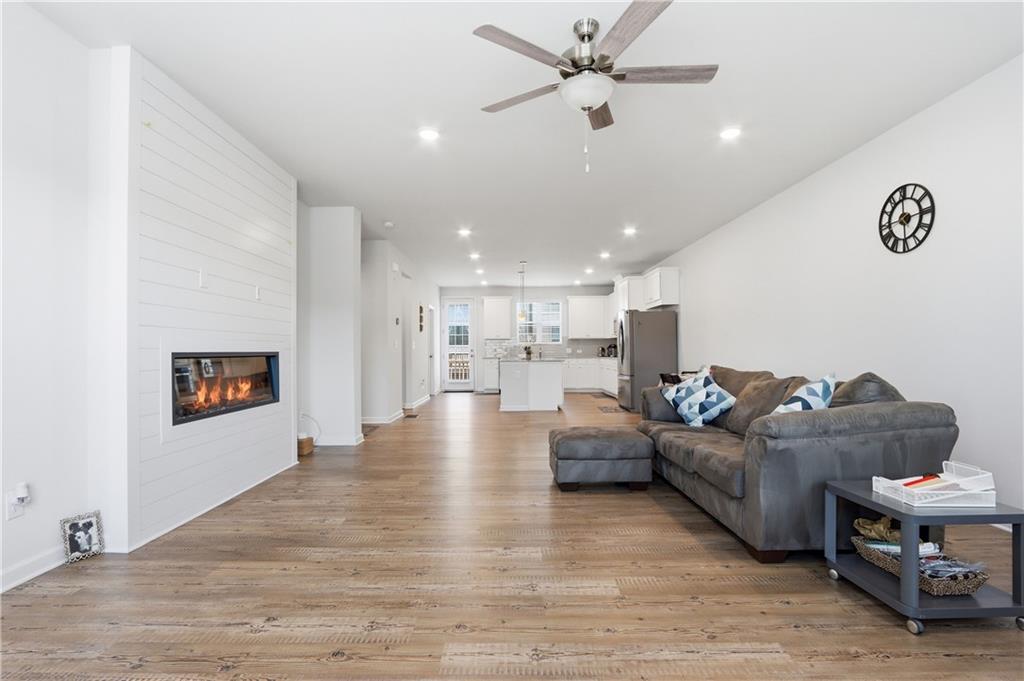3535 Senna Road Duluth, GA 30096 - Photo 38 of 60 a living room with furniture and kitchen view