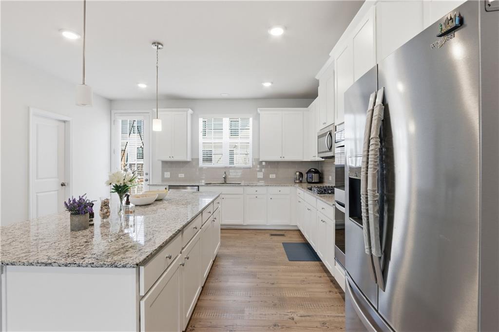 3535 Senna Road Duluth, GA 30096 - Photo 46 of 60 a large kitchen with a lot of counter space