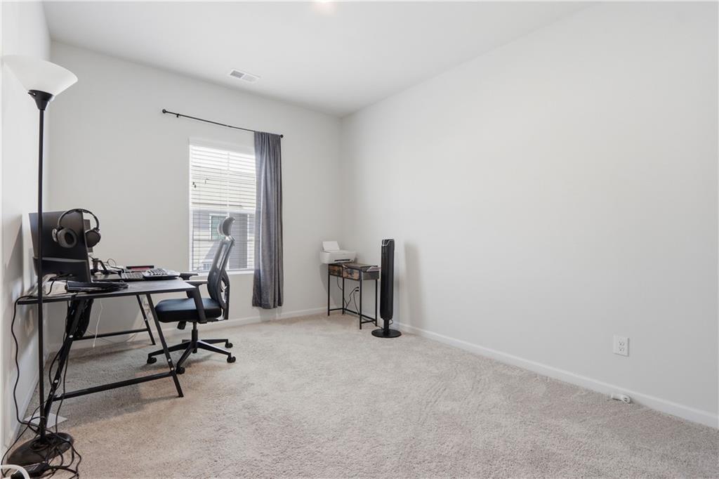 3535 Senna Road Duluth, GA 30096 - Photo 49 of 60 a view of a workspace with furniture and a window