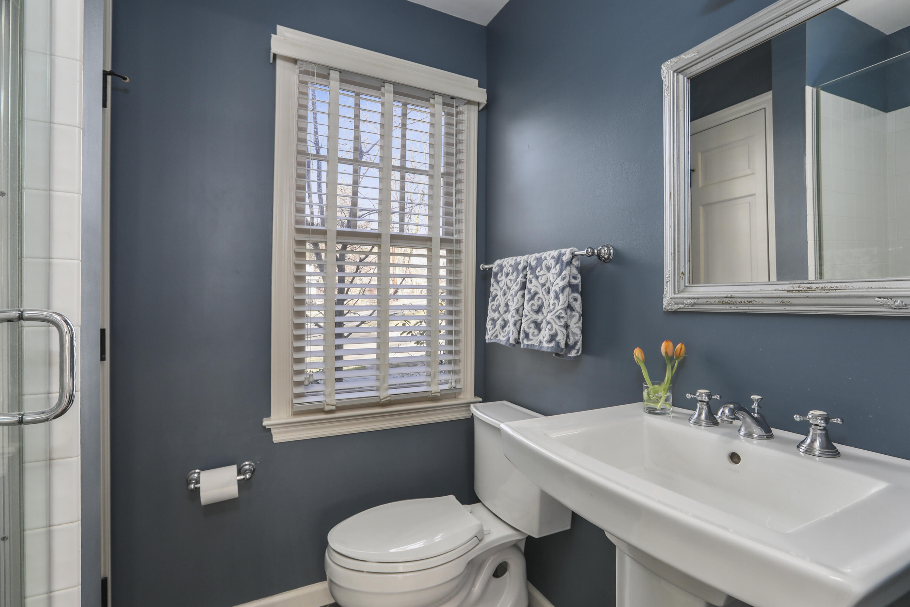 38 Intervale Road Darien, CT 06820 - Photo 13 of 30 a bathroom with a sink a toilet and shower