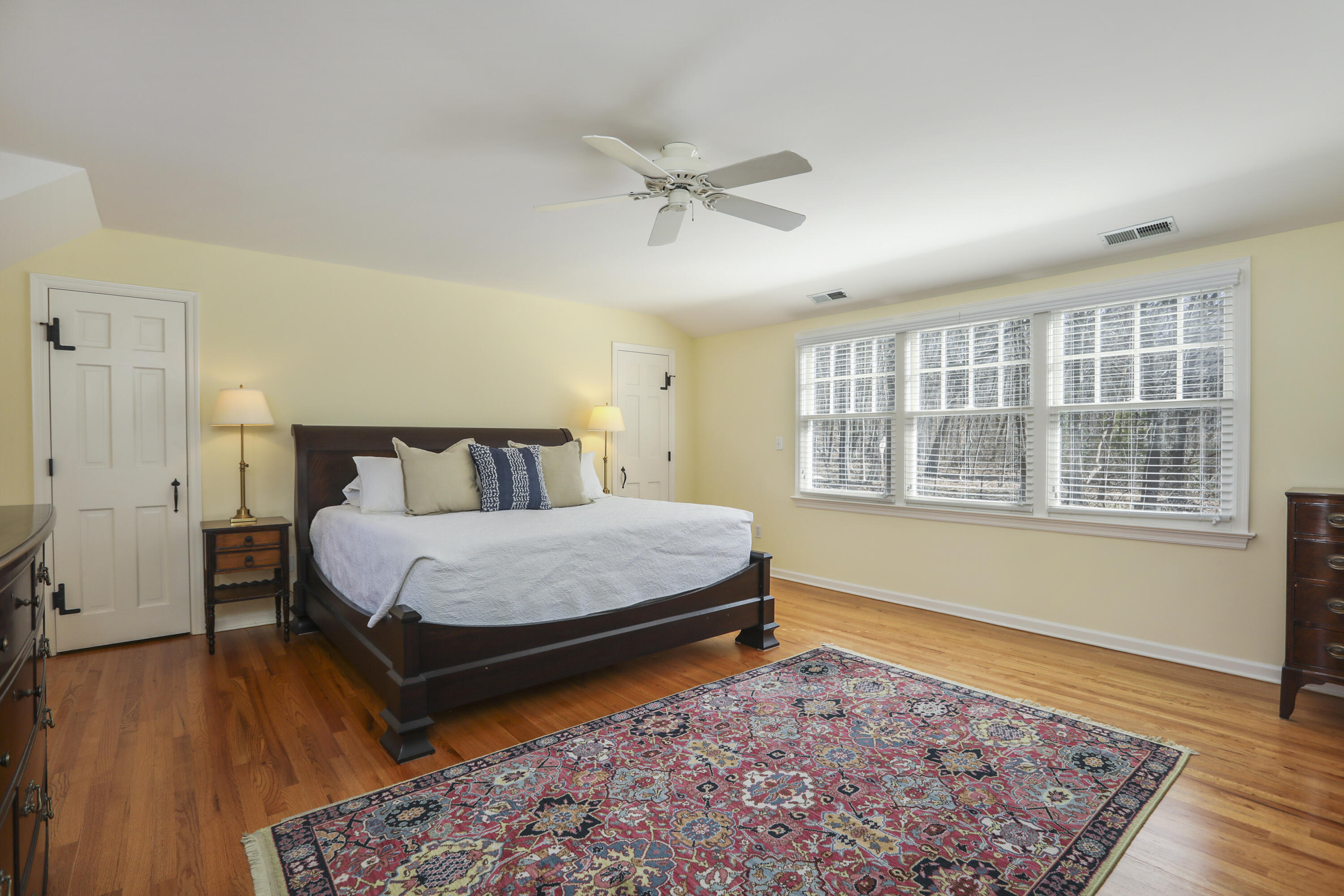 38 Intervale Road Darien, CT 06820 - Photo 15 of 30 a bedroom with a bed and wooden floor